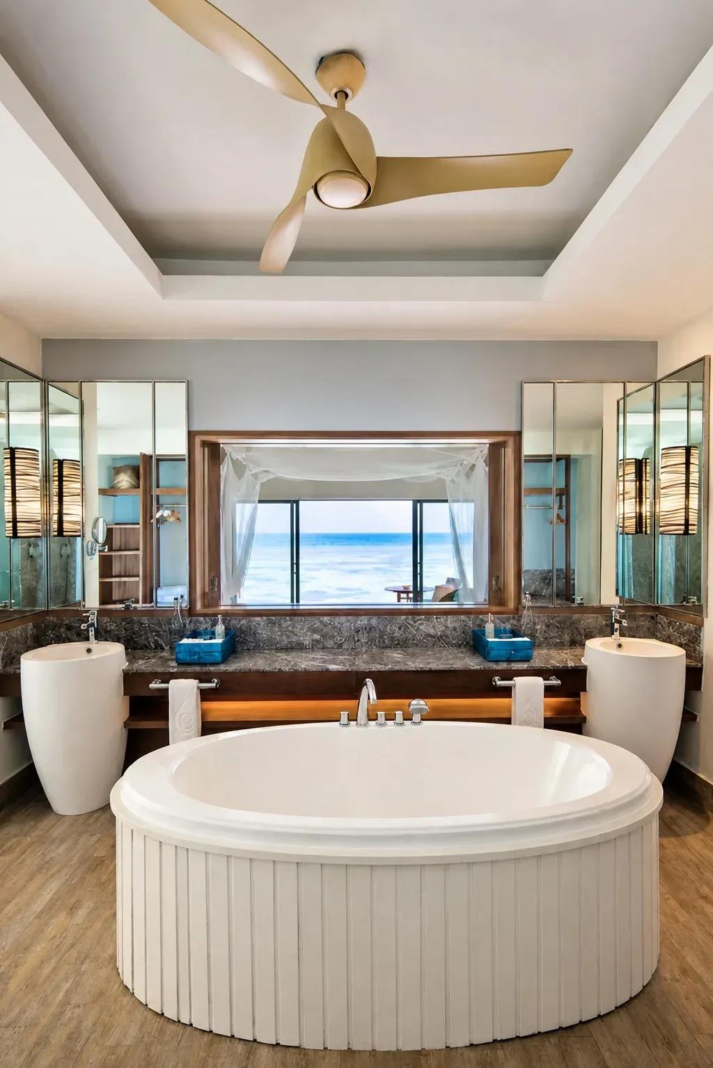 Bagno della Club Sunset Overwater Villa con vasca e vista sull'oceano al Centara Machchafushi Island Resort & Spa Maldives.